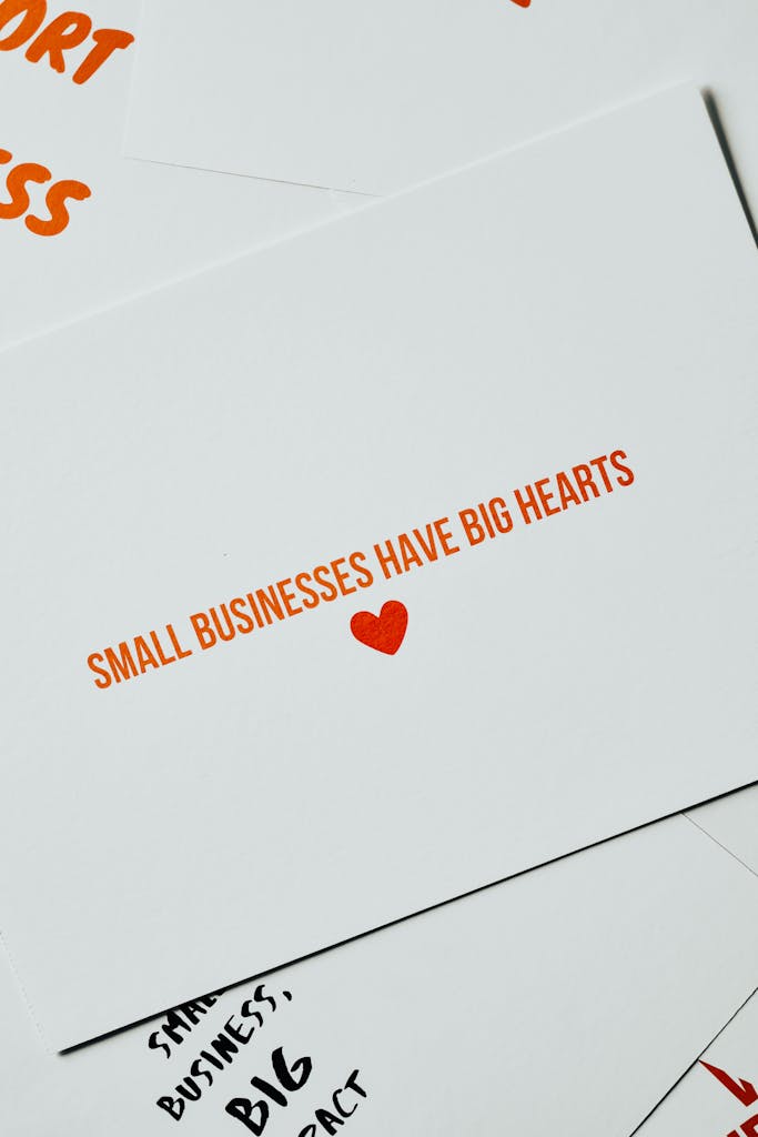 Card with 'Small Businesses Have Big Hearts' message in orange lettering on white background.
